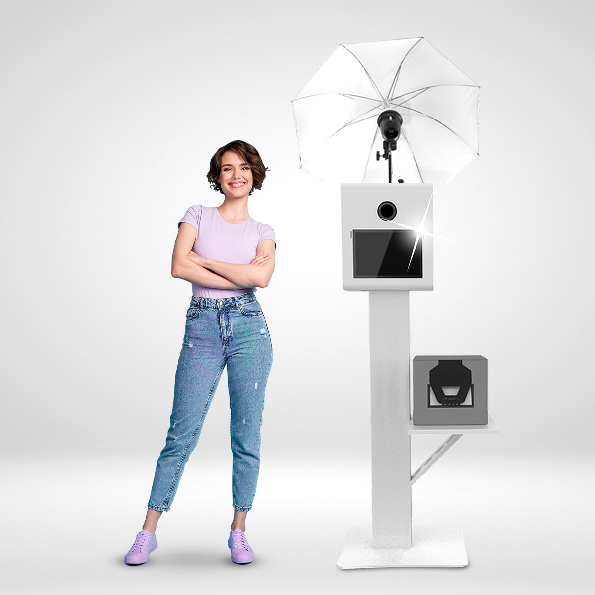 A woman standing next to a photo booth with a DSLR and strobe flash