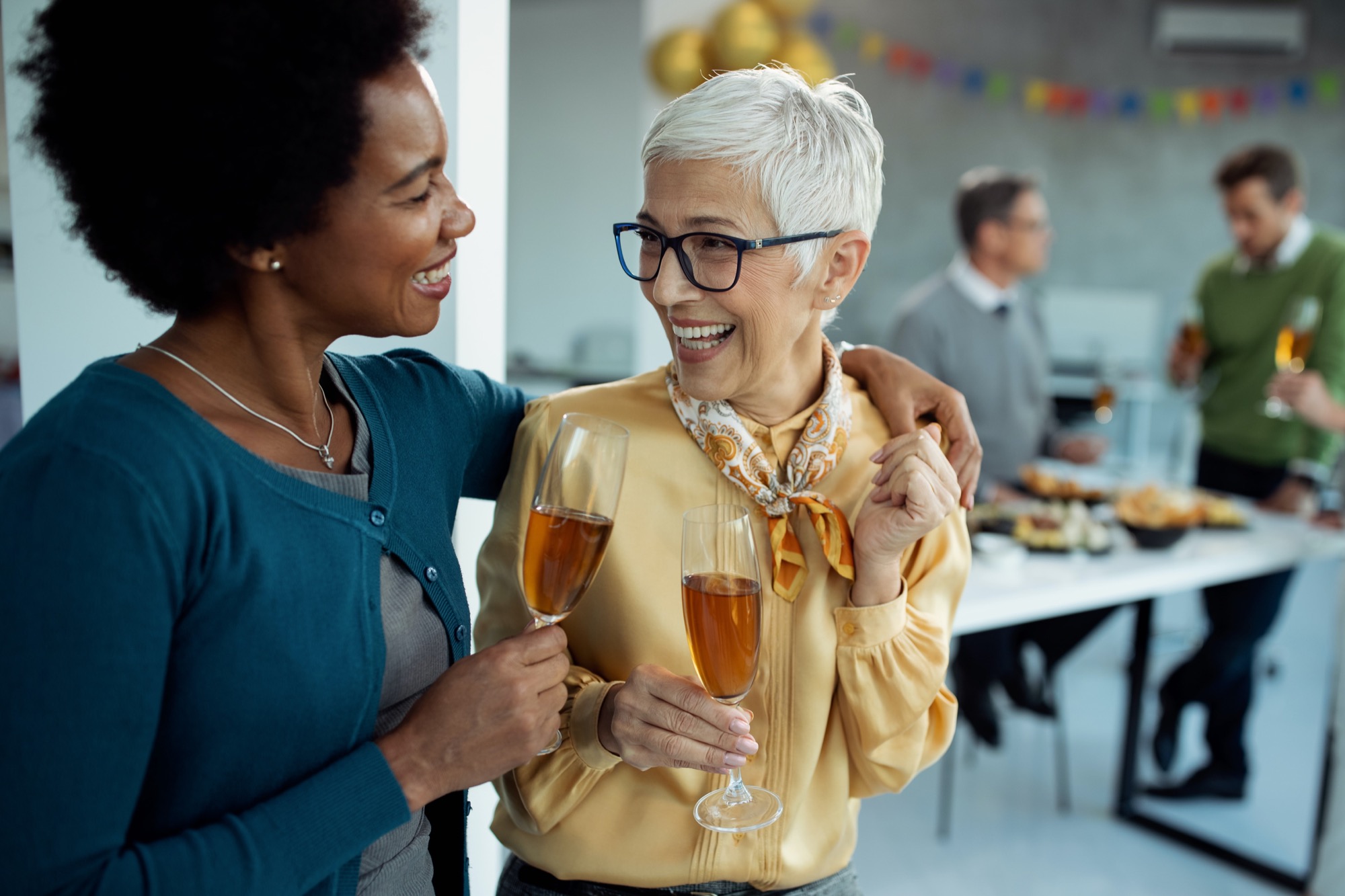 two women laughing at each other